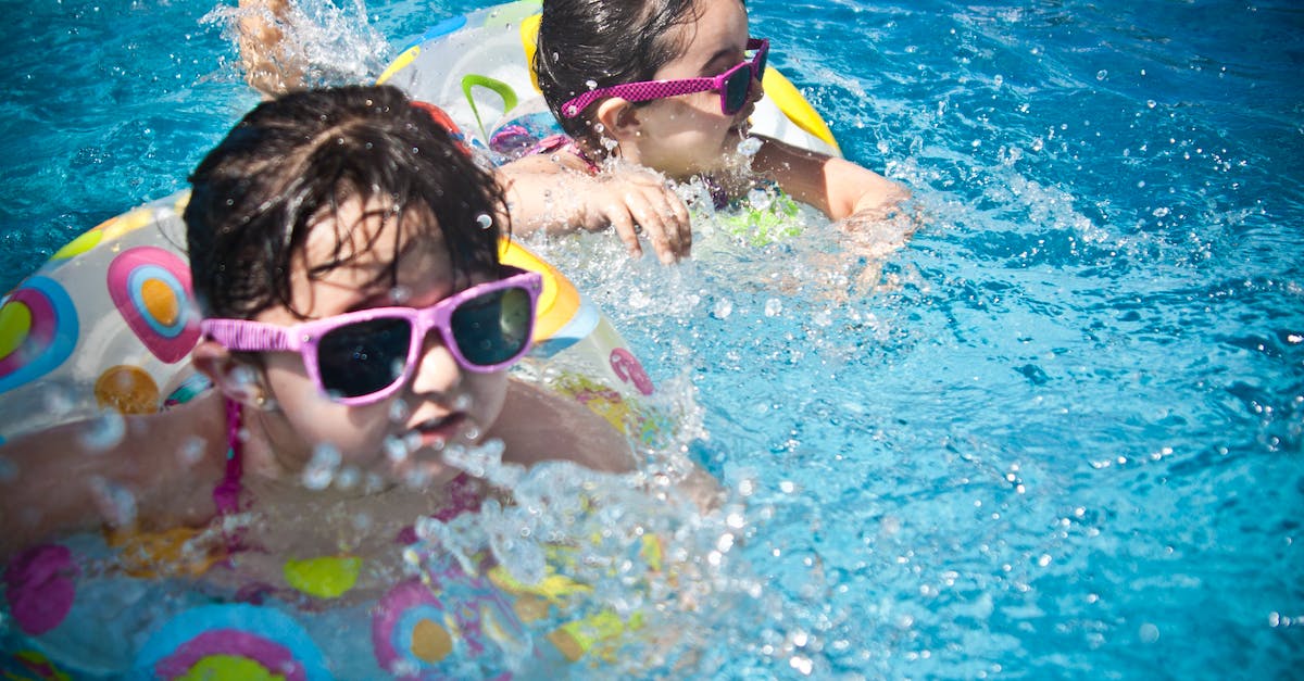 2-girl-s-swimming-during-daytime-2435317