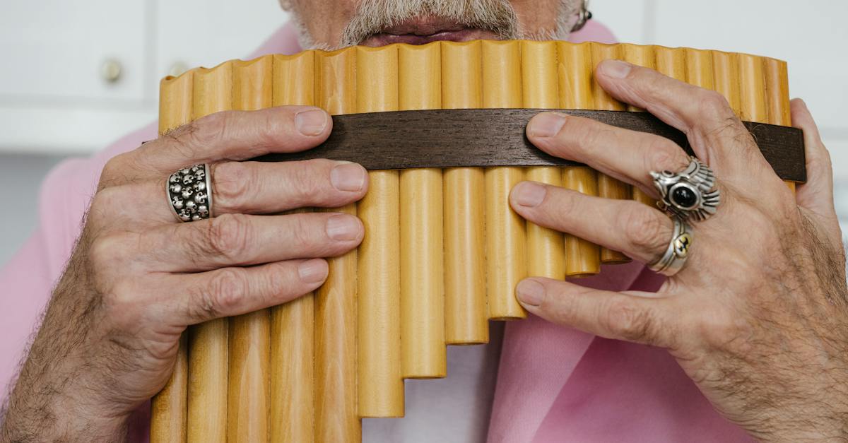 an-elderly-man-holding-a-pan-flute-4035792