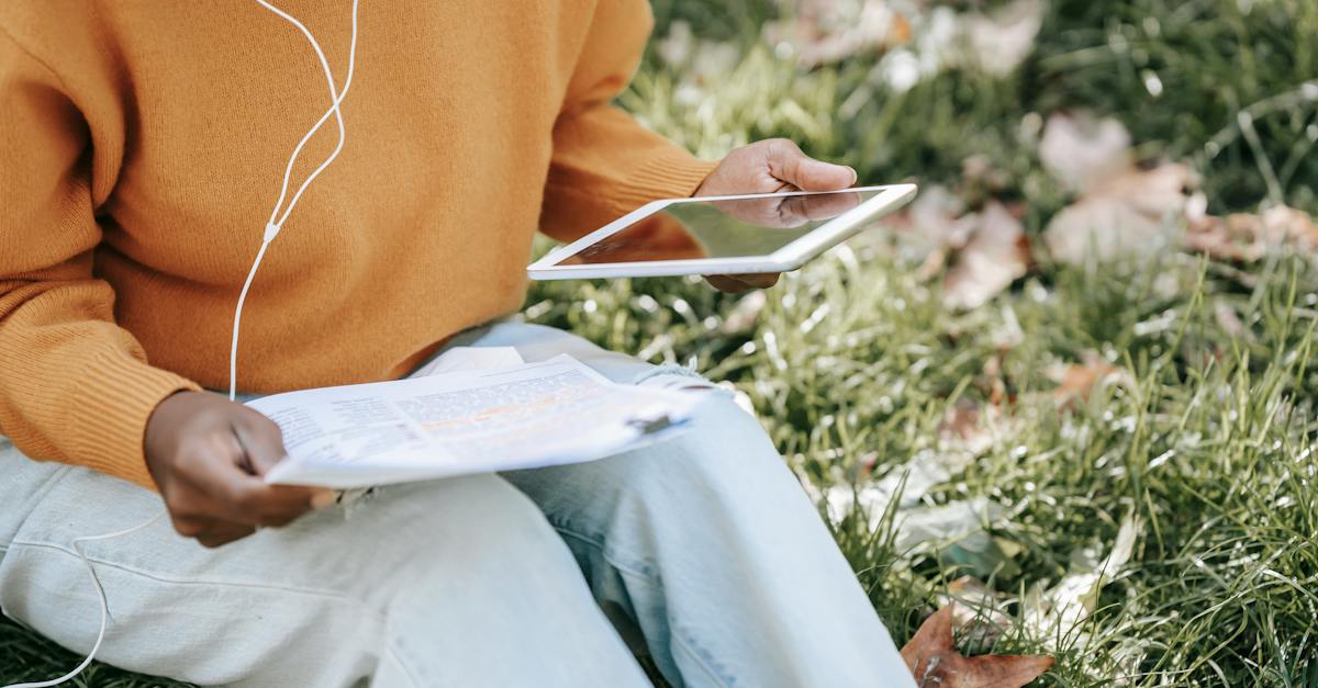 black-woman-using-tablet-and-checking-papers-3819842