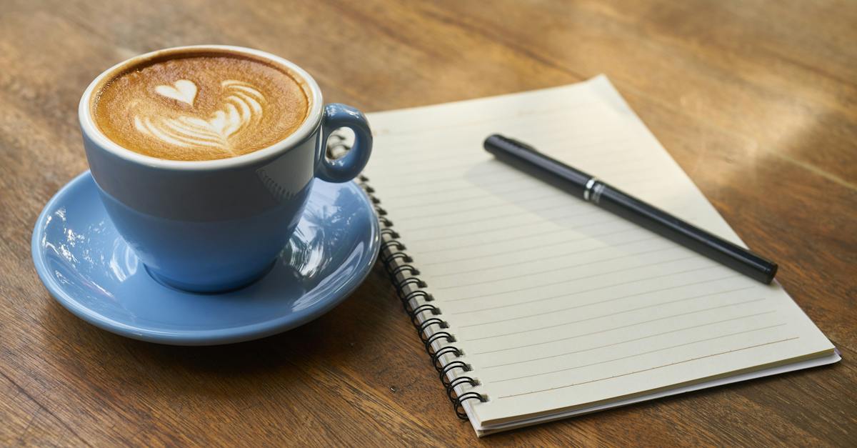 coffee-on-saucer-beside-the-notebook-9774637