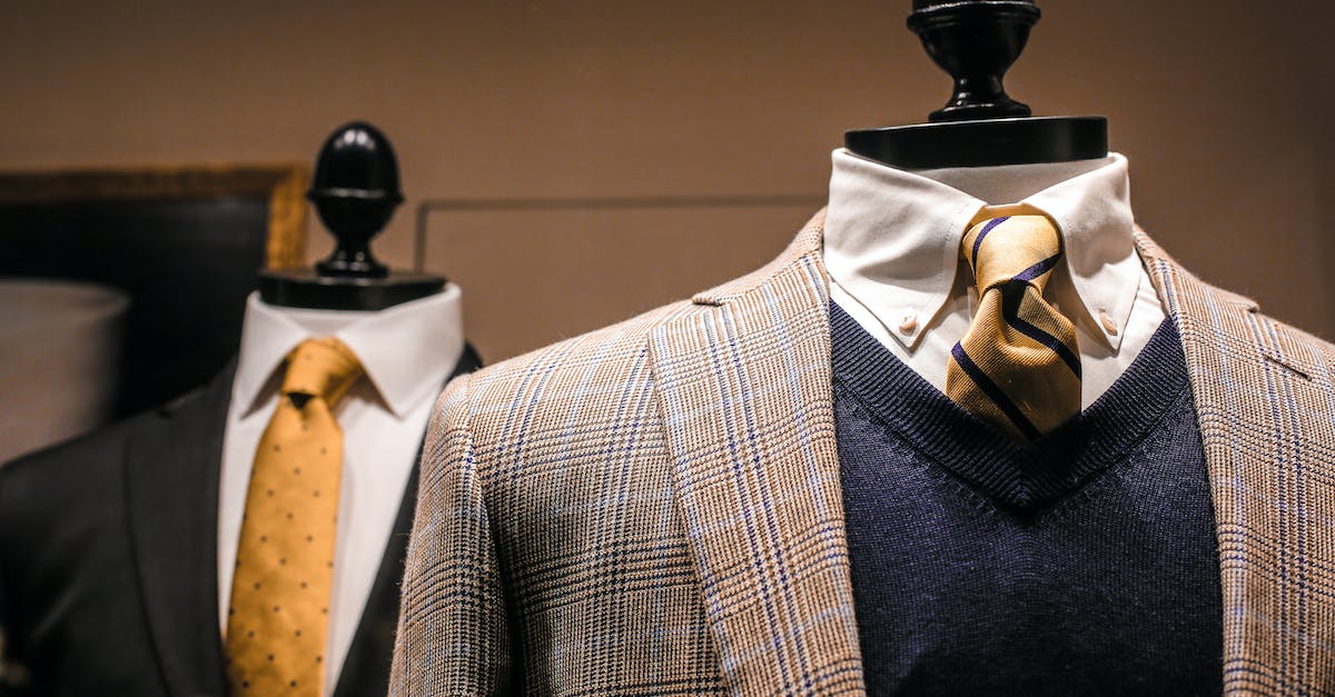 dandy-fancy-jackets-with-shiny-ties-on-dummies-in-showroom-of-contemporary-male-shop-9137718