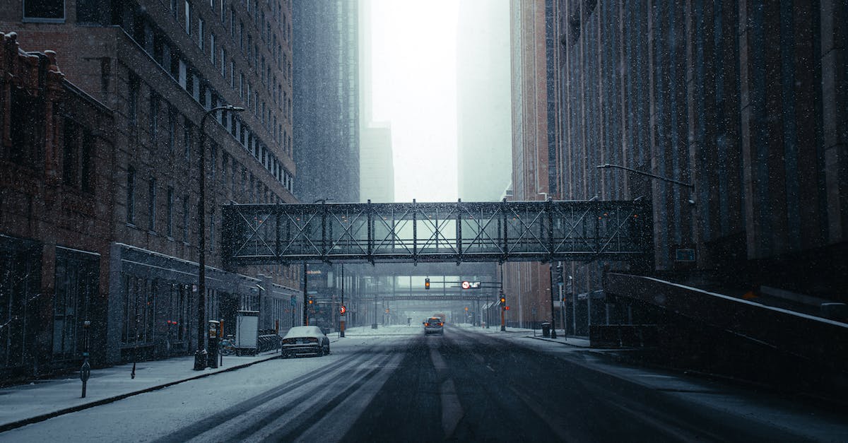 empty-road-between-high-rise-buildings-2465599