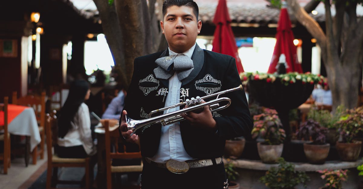 man-in-black-suit-playing-trumpet-8966152