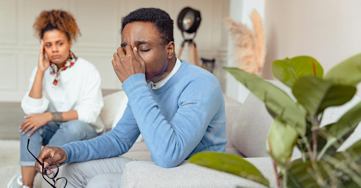 man-in-blue-long-sleeve-shirt-looking-stressed-1074712