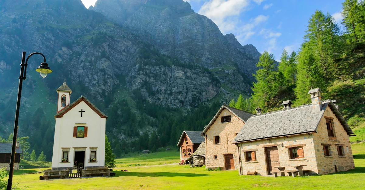 three-houses-near-chapel-below-valley-3816537