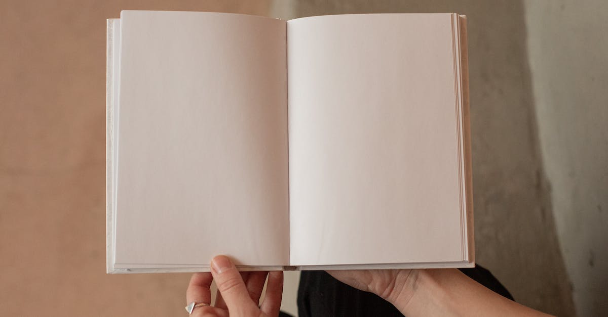 woman-holding-book-with-blank-pages-3268682