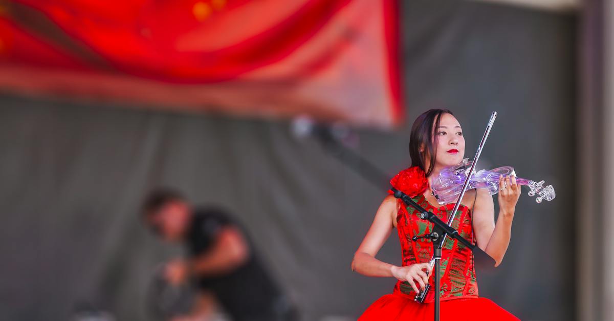 woman-playing-electric-flying-on-stage-2895629